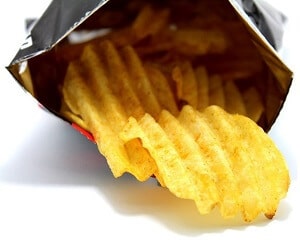 Snack potato chips heaps on a white background